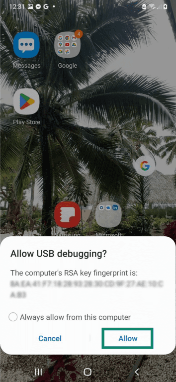 An Android home screen, with the "Allow USB debugging?" prompt message shown on top of it. The "Allow" button is highlighted.